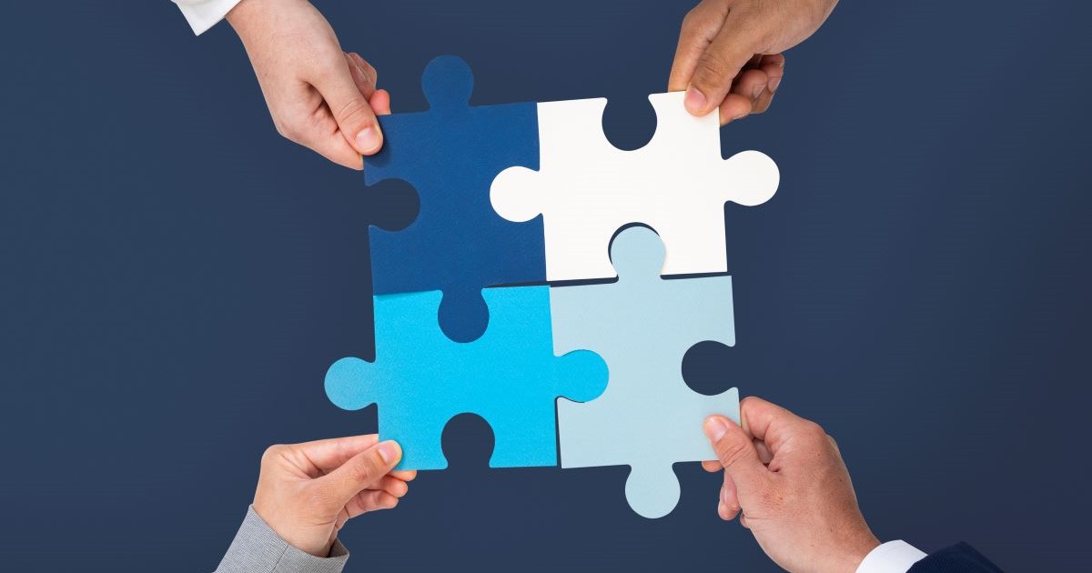 hands holding puzzle business problem solving concept