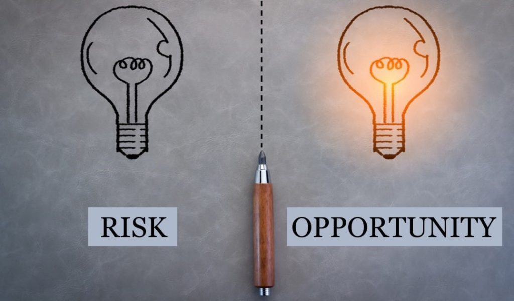 risk versus opportunity idea light bulb