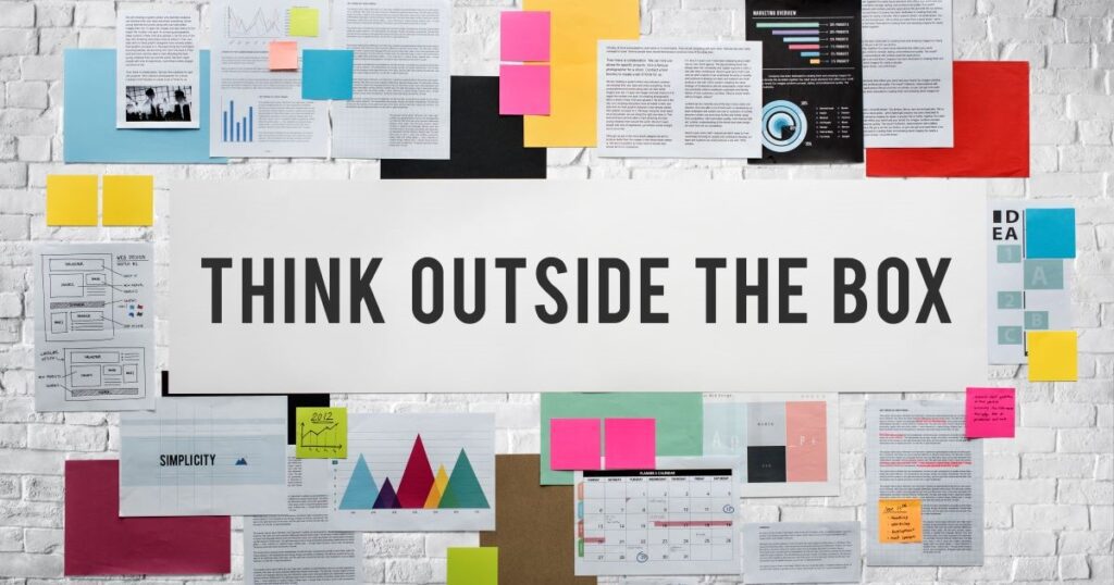 think outside the box words on white wall with documents strategy concept